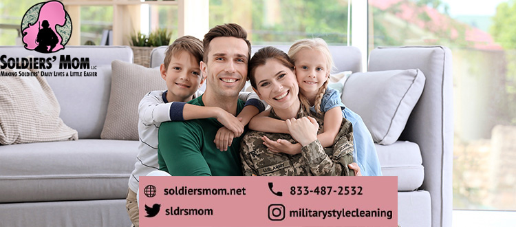 alt="military family siting in the living room"